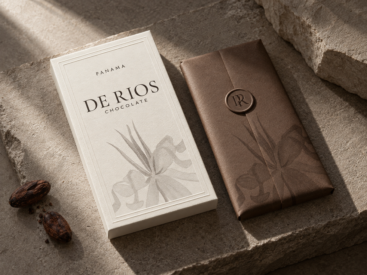 De Rios chocolate box with botanical illustration beside a cocoa bar sealed with a DR wax stamp
